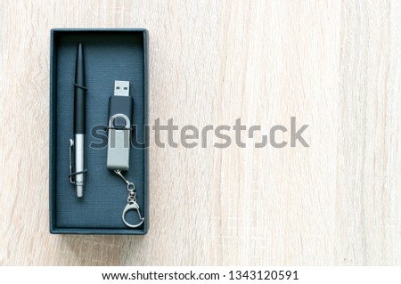 pen and USB flash drive in a gift box