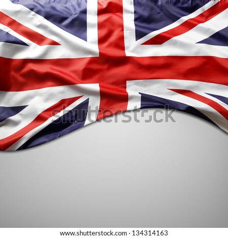 Closeup of Union Jack flag on plain background. Copy space