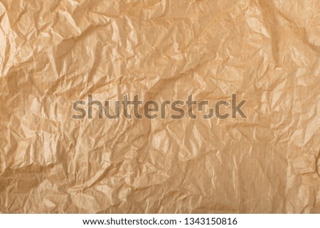 Crumpled Craft Paper Top View with Copy Space for Collages, Design and Montage. Empty Wrinkled Sheet of Brown Wrapping Old Paper Texture with Place for Text