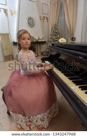 teen blonde in gorgeous white with pink dress by the piano