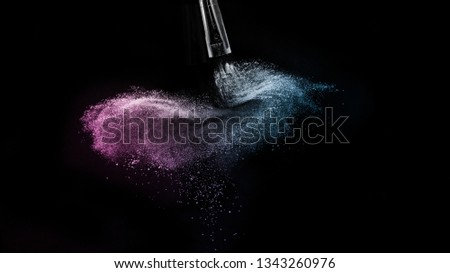 purple and blue ocean powder color splash and brush for makeup 