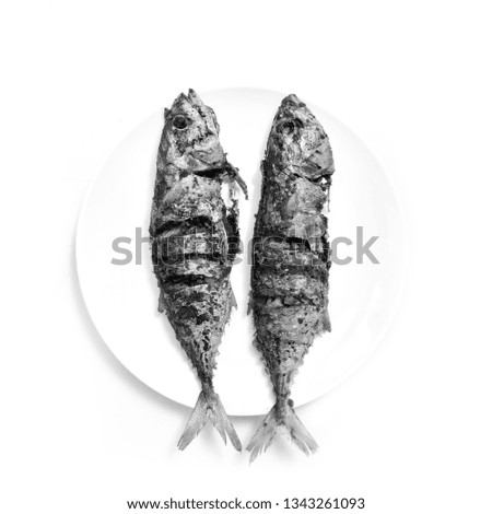Fresh Fried fish in white background. black and white photography.