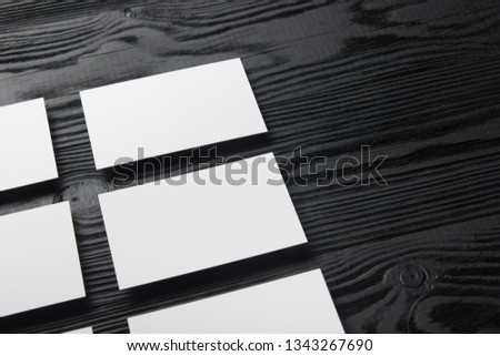Business card blank on wooden background. Corporate Stationery, Branding Mock-up. Creative designer desk. Flat lay. Copy space for text