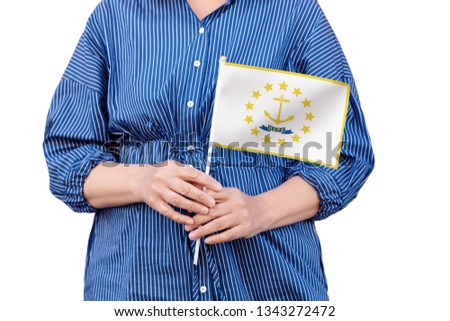 Rhode Island state flag. Close up of woman's hands holding flag of Rhode Island isolated on white background.