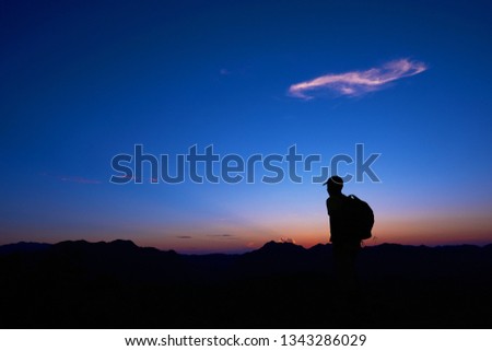 
Silhouette of travelers