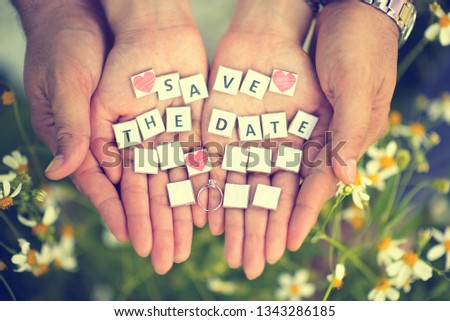Blank paper on the hands which can write date, month and year on it in wedding ceremony