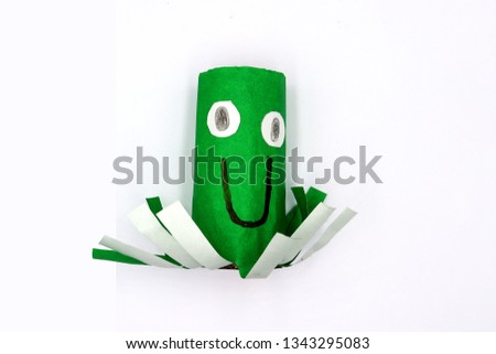 kids hand craft, octopus make from empty toilet rolls isolated on white background 