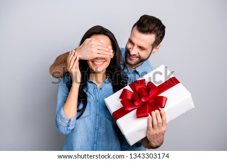 Close up photo amazing she her he him his lady guy hide eyes guess who game prepared romance surprise hold big large giftbox wear casual jeans denim shirts outfit clothes isolated grey background