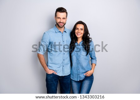 Close up portrait beautiful amazing cheer she her he him his couple lady guy friends stand close hands arms pockets wear casual jeans denim shirts outfit clothes isolated light grey background Royalty-Free Stock Photo #1343303216
