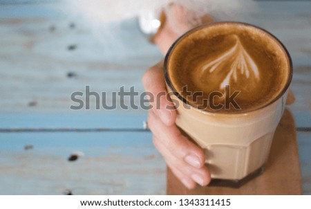 coffee latte art espresso in coffee shop vintage color tone,soft focus,noise, film grain