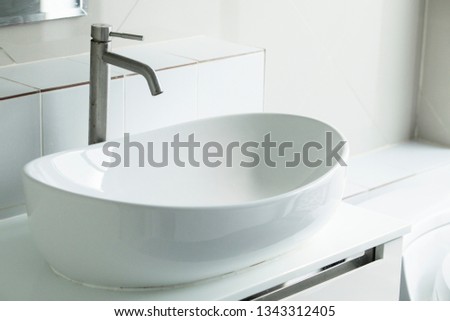 Interior of bathroom with sink basin,Modern bathroom in luxury house,Modern wash basin in the bathroom Royalty-Free Stock Photo #1343312405