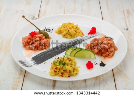 ceviche. Three colorful shrimps ceviche with mango, avocado and tomatoes. Latin American Mexican Peruvian Ecuadorian food. on white wooden background
