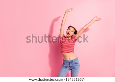 Portrait of her she nice cute charming attractive lovely sweet winsome crazy careless cheerful girl in striped t-shirt raising hands up summer isolated on pink pastel background