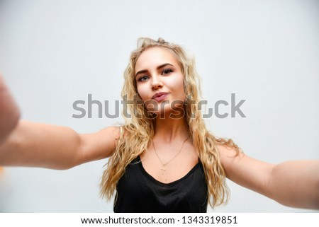 Beauty Woman Portrait. model Girl with Perfect Fresh Clean Skin. Photo of blond female model with white teeth looking at camera and smiling. Isolated on a white background