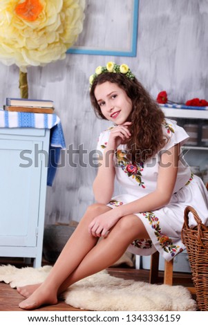 Beautiful teen girl in national dress. captured in studio
