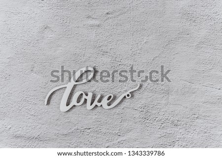 Wooden word "love" on white background. Love minimal concept. Greeting card. Top view. Flat lay. Copy space.