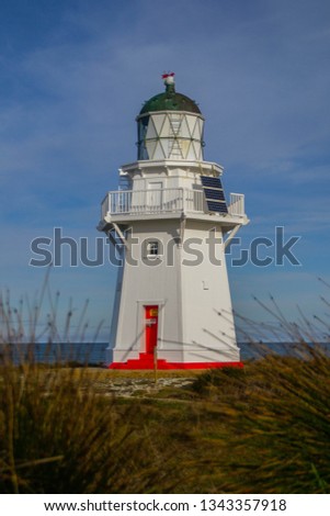 Travel New Zealand, Catlins Conservation Park, Southland. Scenic panoramic landscape view of the white Waipapa Point Lighthouse in South Island.Tourist/backpackers popular attraction/destination.