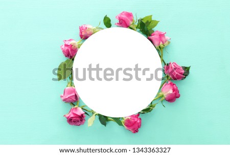 Top view of empty sircle over pink roses flowers. Flat lay