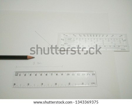 Protractor, ruler, paper and pencil are on white background.(9)