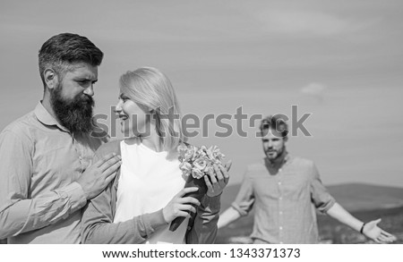 Ex partner watching girl starts happy love relations. Couple in love dating outdoor sunny day, sky background. New love. Couple with flowers bouquet romantic date. Ex husband jealous on background.