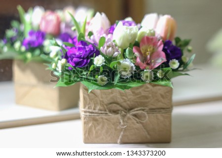 Background with fresh pink hyacinths in box and willow flowers and heart on turquoise painted wooden planks. Selective focus.