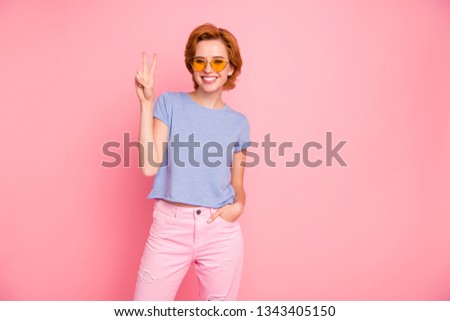 Portrait of her she nice cute charming attractive lovely sweet cheerful cheery girl wearing casual look yellow glasses showing v-sign isolated over pink pastel background