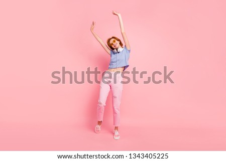 Full length body size view portrait of her she nice cute charming attractive lovely optimistic cheerful cheery girl rejoicing having fun isolated on pink pastel background