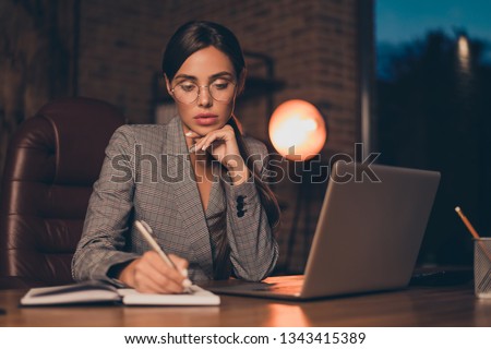 Close up photo beautiful she her business lady chief got promotion work day night first startup get some mistakes moments write down sit big office chair wear specs formal wear checkered plaid suit