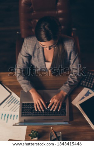Vertical top above high angle view photo beautiful she her business lady work day night notice web course information table full papers text notebook sit office chair wear formal wear checkered suit