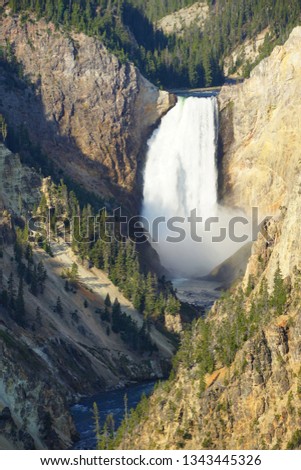 View of the Lower Falls waterfall and the Yellowstone River from the Artist Point lookout in Yellowstone National Park, Wyoming