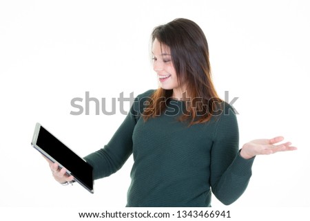 Portrait with copy space empty place of pretty charming confident trendy woman in classic green sweater having tablet in hands isolated on white background