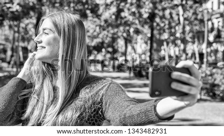 Happy girl making selfie outdoor.