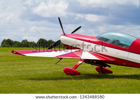 Red and white plane Royalty-Free Stock Photo #1343488580