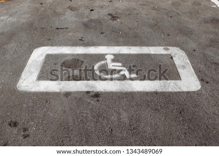 Horizontal road surface marking "A parking place reserved for disabled people"