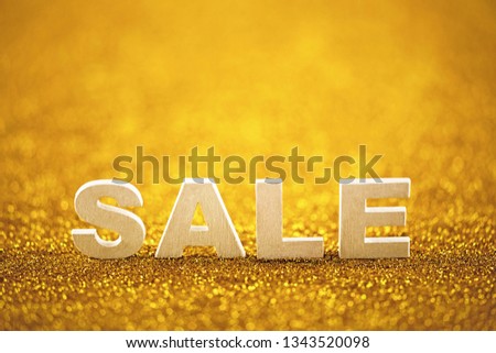 Word sale over golden glitter background
