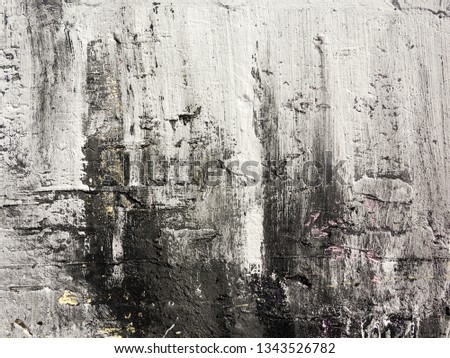Rough paint dripping, spray paint artwork. Abstract background oil paint painting style. Damage to walls with many colors. Rough concrete surface with cracks, scratches and paint stains