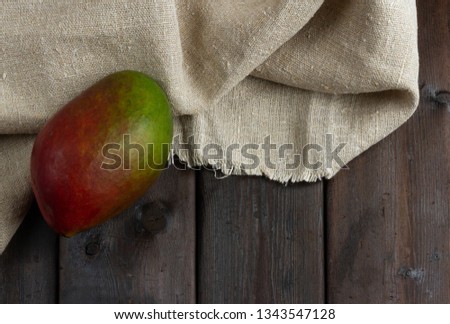 mango on dark wooden background