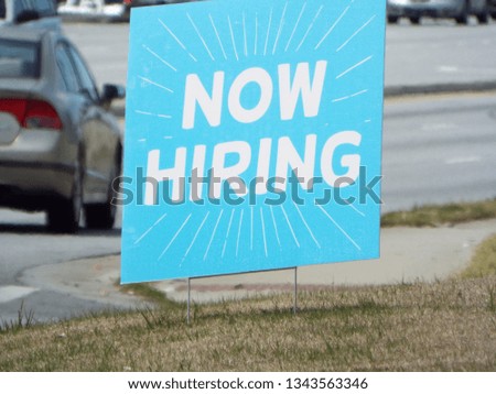 Now Hiring sign outdoors