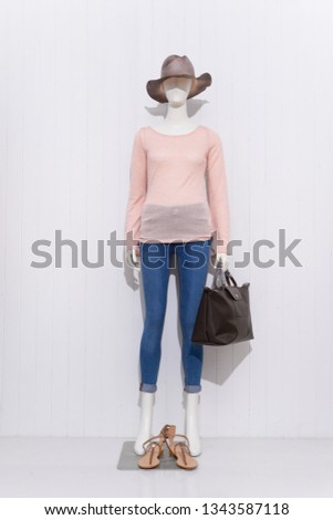 full-length female clothing with jeans ,hat ,shoes,handbag on mannequin

