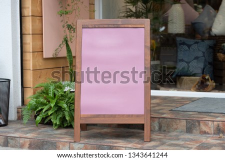 Large blank billboard on a street wall, banners with room to add your own text
