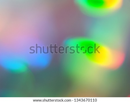 Holiday bokeh green blue and pink lights festive background. Holographic backdrop. Design for your ad, poster, banner