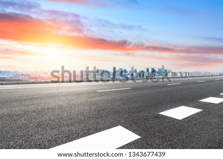 Asphalt highway passing through the city above in Shanghai at sunset
