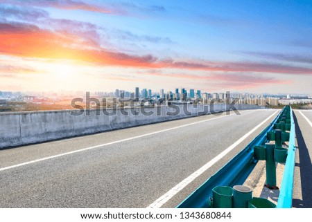 Asphalt highway passing through the city above in Shanghai at sunset