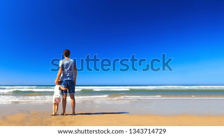 Family vacation on the sea, copy space, back view, 