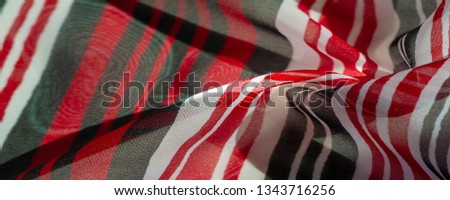 Background texture. multicolored striped silk fabric. Mexican coloring theme bright colored striped pattern with abstract stripes