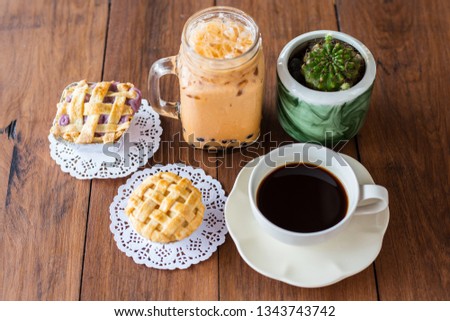 Coffee Ice Bubble Tea and Pie on wooden table