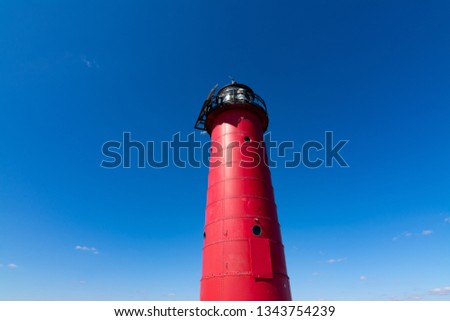 Brilliant blue skies over the Kenosha North Pier Lighthouse.  Kenosha, Wisconsin, USA