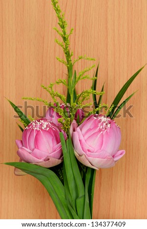 Pink Lotus on Wooden Background.