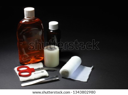 Bottles of disinfectant,ointment,tape and bandages are crucial items to clean and care for wounds.