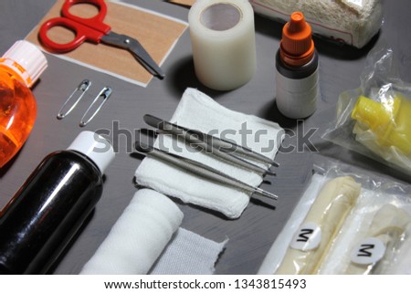 Items in a first aid kit should include disinfectant,ointments,bandages,tape,scissors,gloves,tweezers,and safety pins.Healthcare starts in the first aid kit.